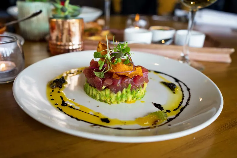 Tuna tartare over avocado with microgreens and citrus oil at Massimo on Federal Hill in Providence