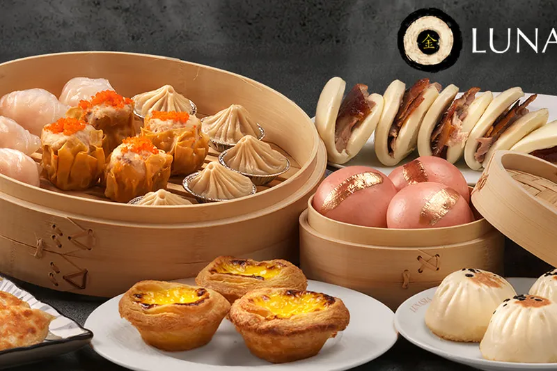 Bamboo steamers of dim sum and egg tarts at Lunasia