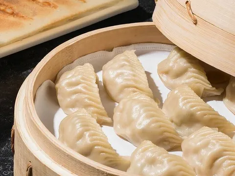 Steamed dumplings in a bamboo basket at Din Tai Fung Century City