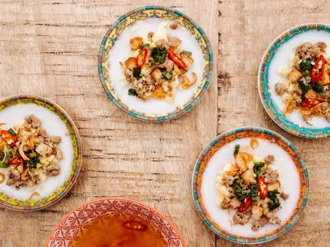 Banh beo (steamed water fern rice cakes) on colorful plates at Hai Hai in Minneapolis