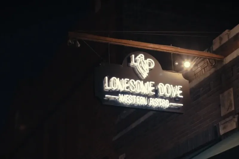 Illuminated Lonesome Dove Western Bistro sign on the Fort Worth exterior