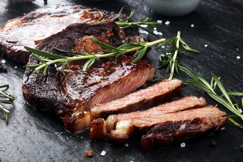 Sliced steak with rosemary at Over The Moon Cafe