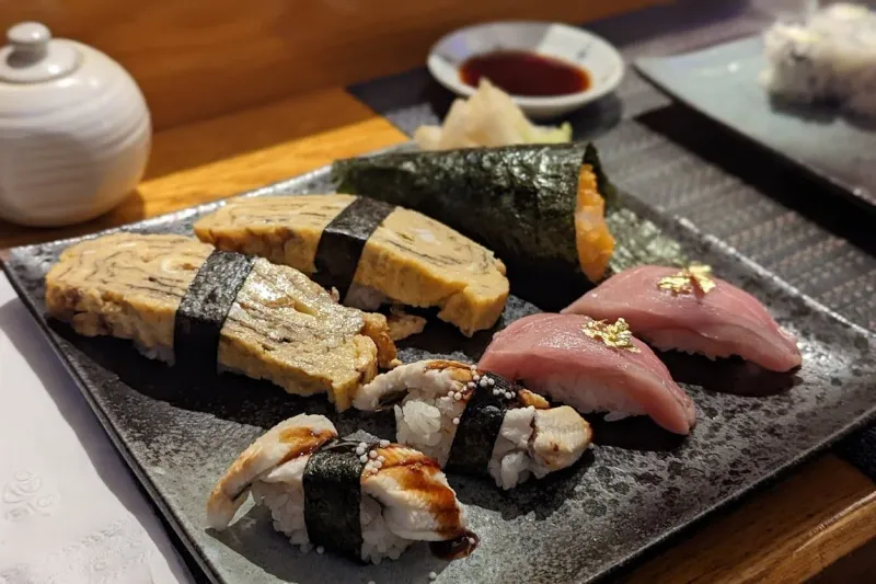 Assorted nigiri and sushi rolls at Higuma